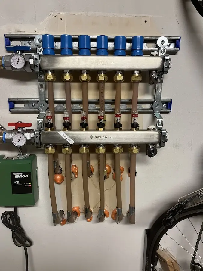 Plumber performing Water Heater Repair at a residential property in Coquille